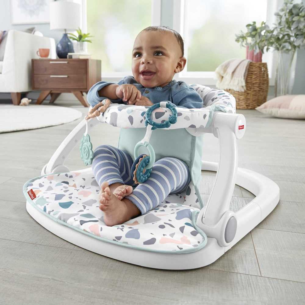 Fisher-Price Portable Baby Chair Sit-Me-Up Floor Seat with Developmental Toys & Machine Washable Seat Pad, Rainbow Showers